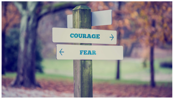 fear and courage road sign